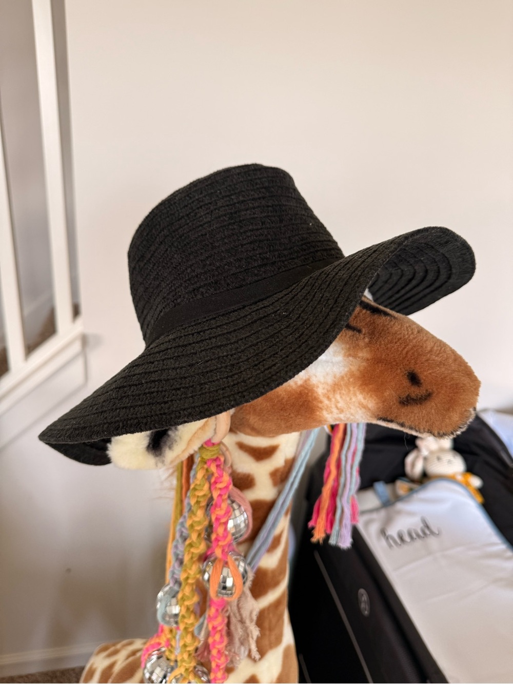 Free People Black Wide-Brim Hat on Stuffed Giraffe